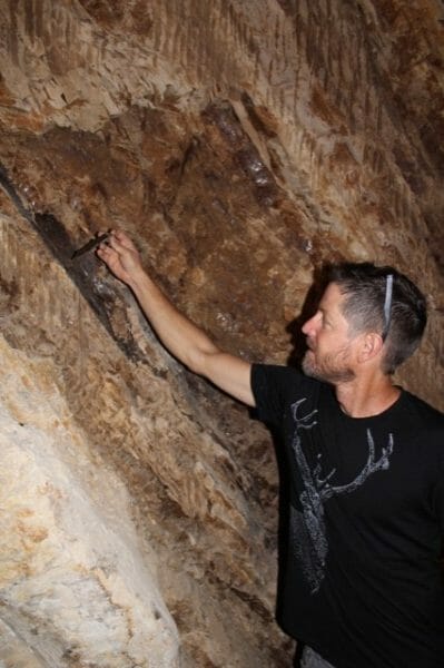 Justin Smith during construction of his tunnel- with a Very deep vine.